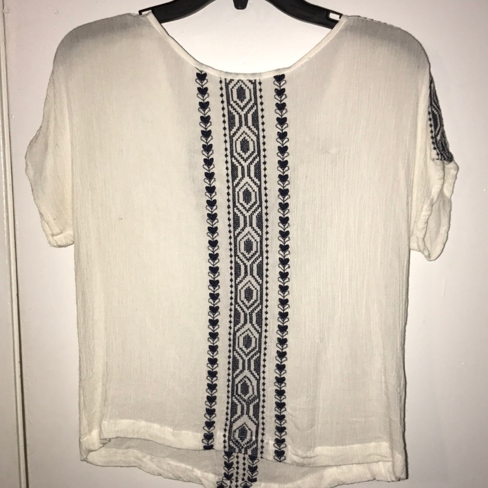 White and blue patterned top
